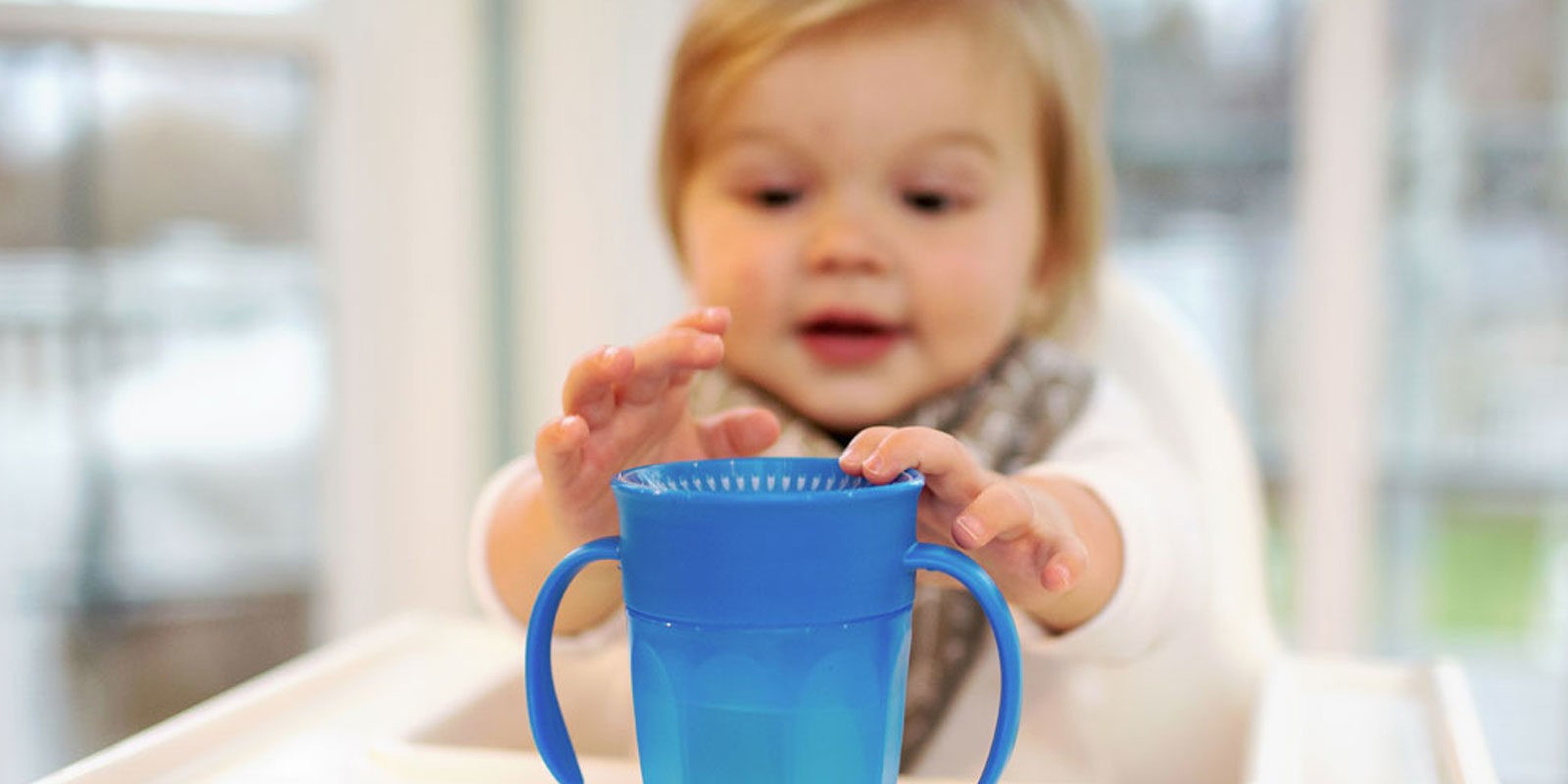 Toddler reaching for Cheers360 Cup
