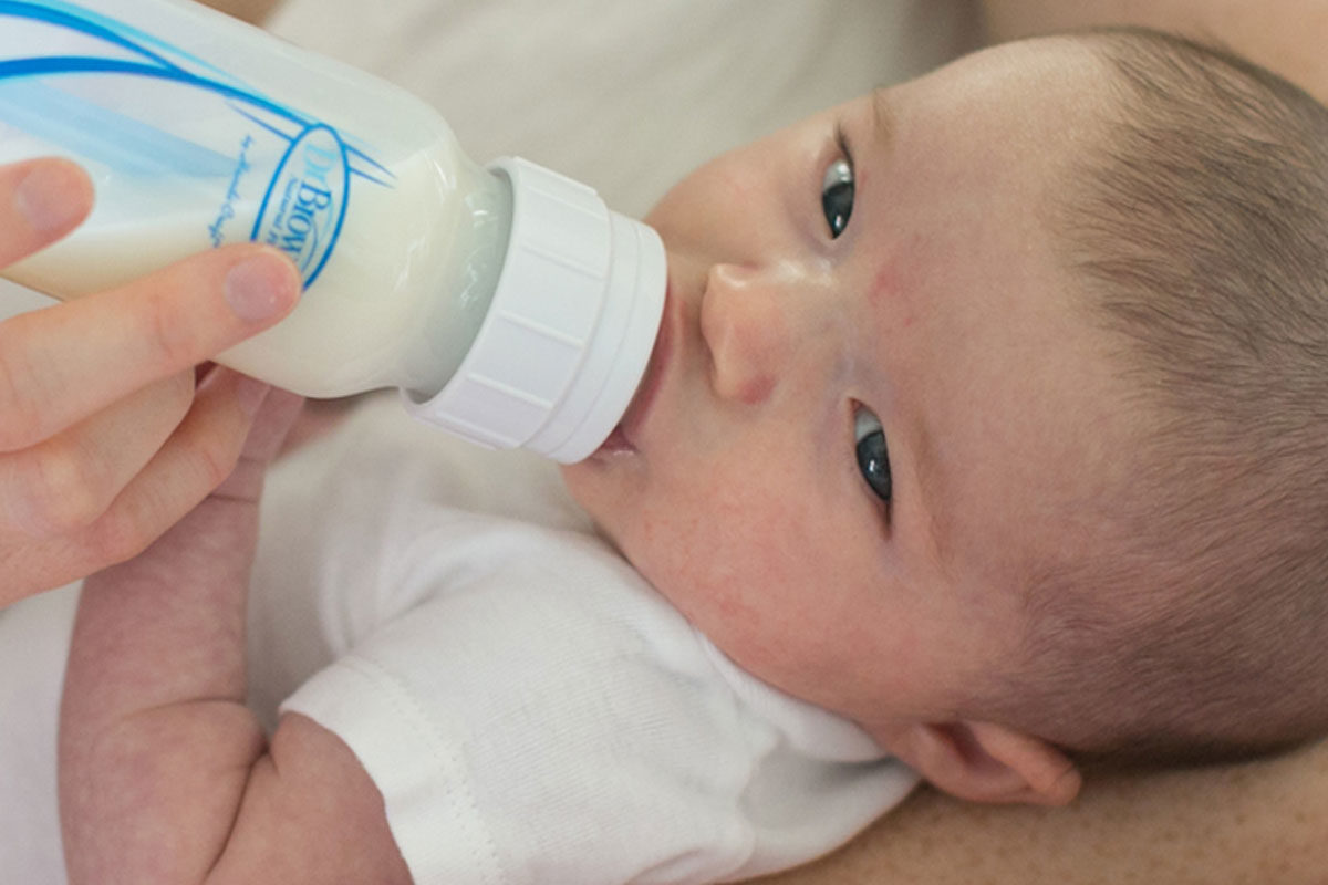 Premature baby drinking from Dr. Brown's bottle