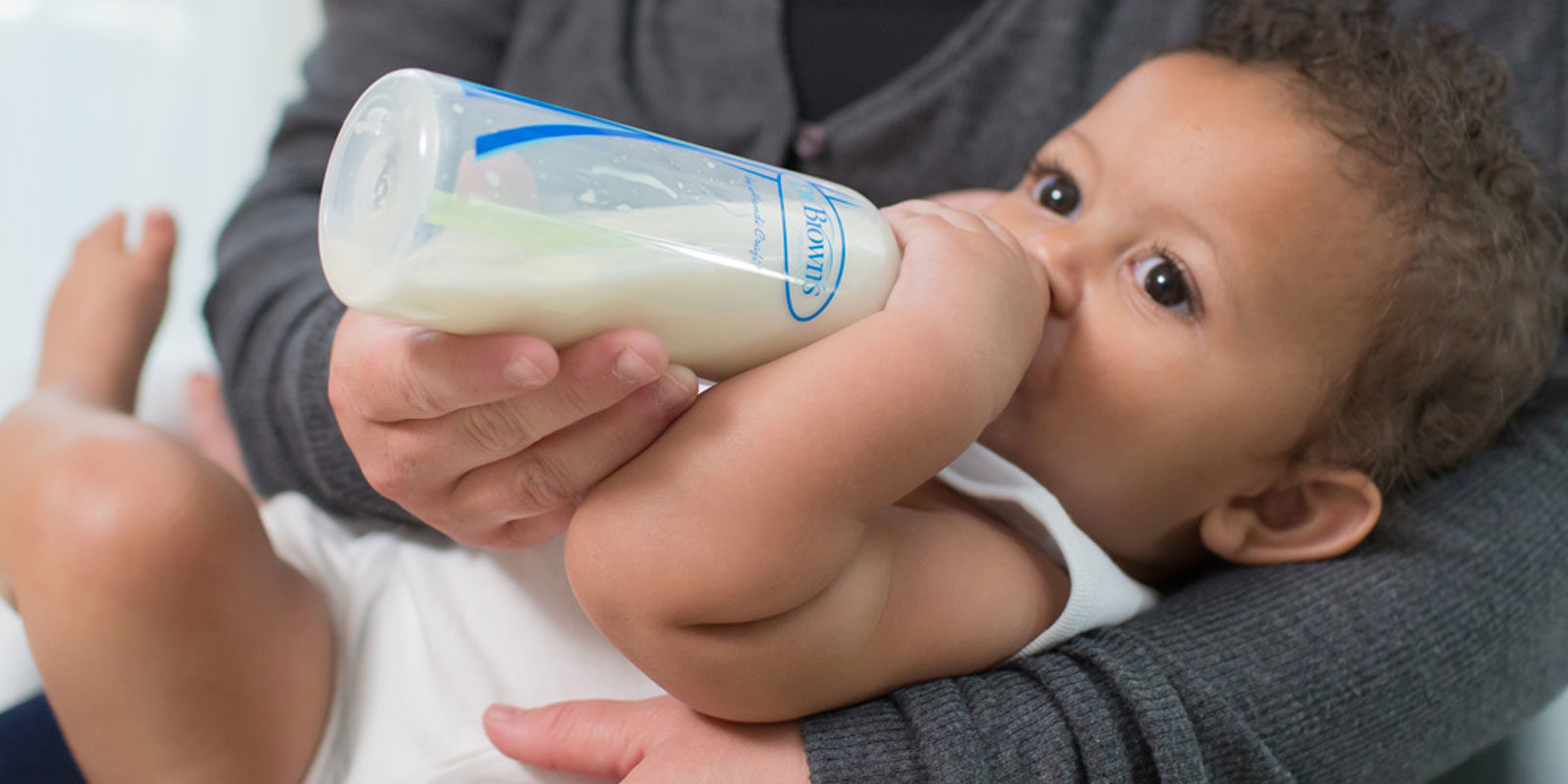 Baby drinking from a Dr. Brown's bottle