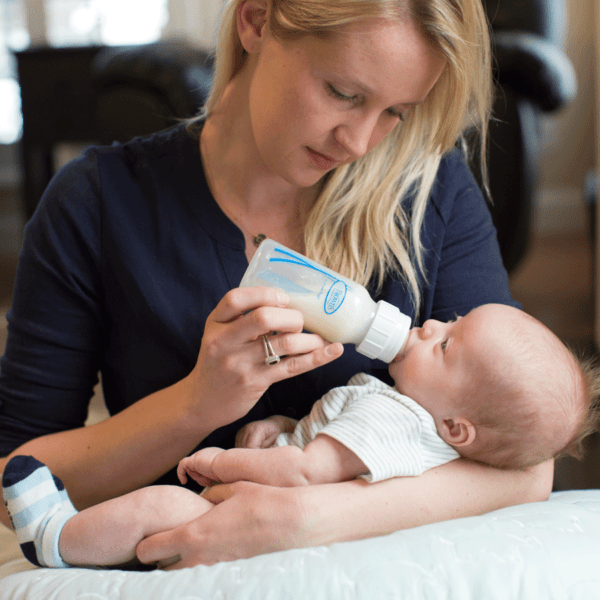 mother feeding newborn from Dr. Brown's bottle