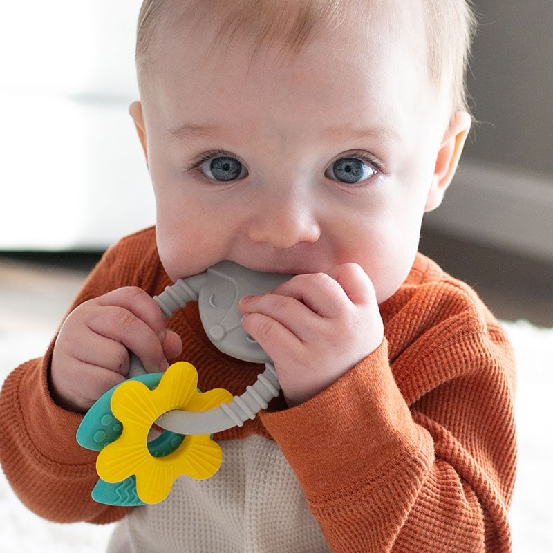 Baby chewing on a Dr. Brown's teether ring