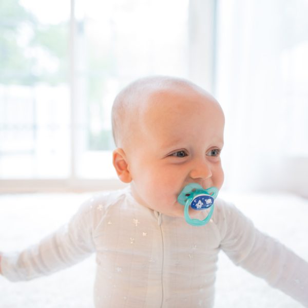Baby with Blue Pacifier in mouth