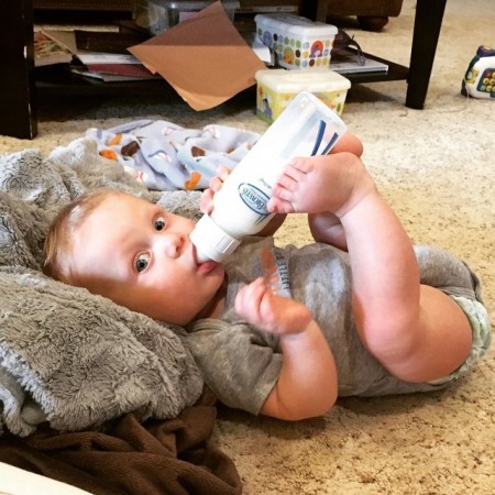Cole drinking from Dr. Brown's bottle
