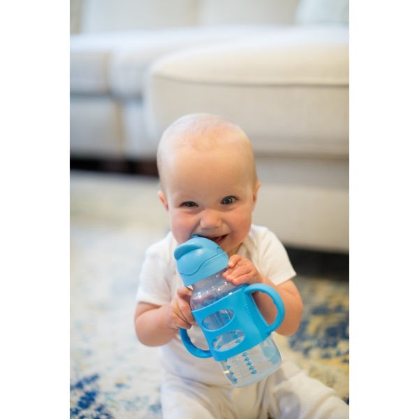 Baby holding a Dr. Brown's SIppy Straw Bottle with Handles