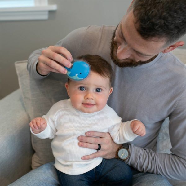 Man using a Whale Cold Compress on baby