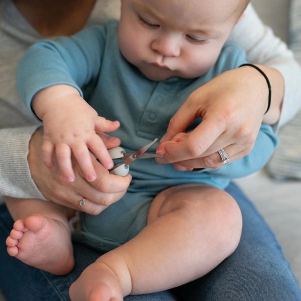 Parent clips baby's nails with Safe Squeeze Nail Scissors