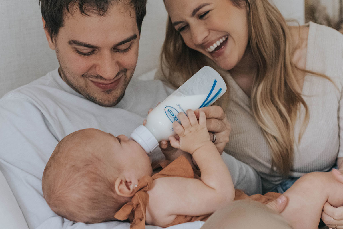 Anti-colic bottle feeding mom, dad, and baby