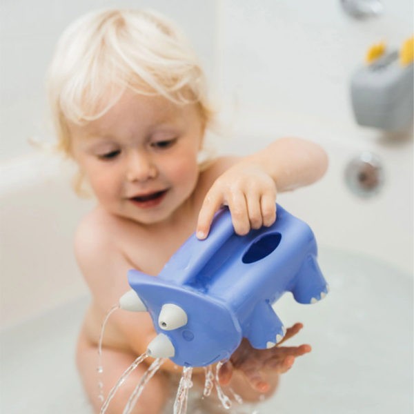 Baby playing with Pour and Roar Bath Watering Toy