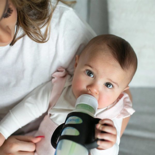 Parent holding a baby with a sippy bottle with black Narrow Silicone Handles