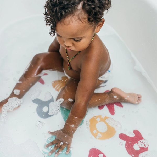Toddler in a tub with Non-Slip Bath Stickers