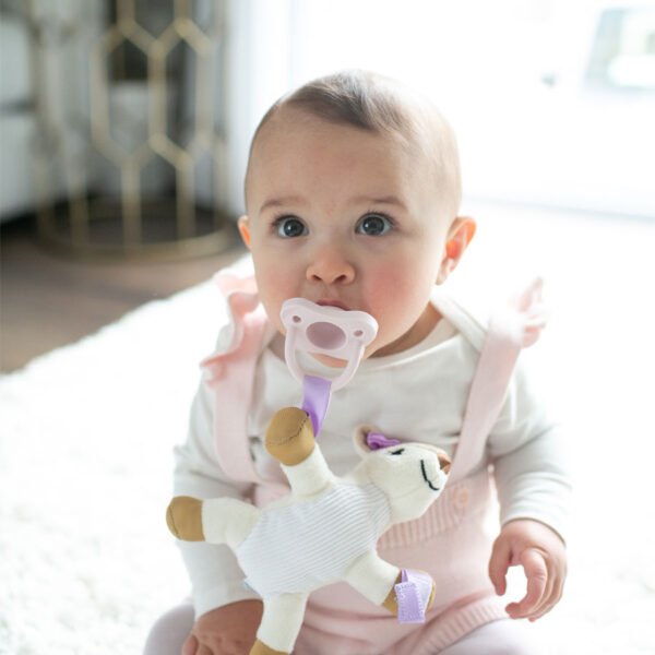 Infant with Deer Lovey and light pink pacifier
