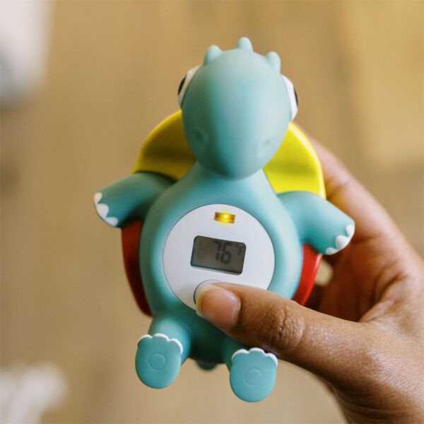 Person holding Temposaurus™ Floating Bath Thermometer